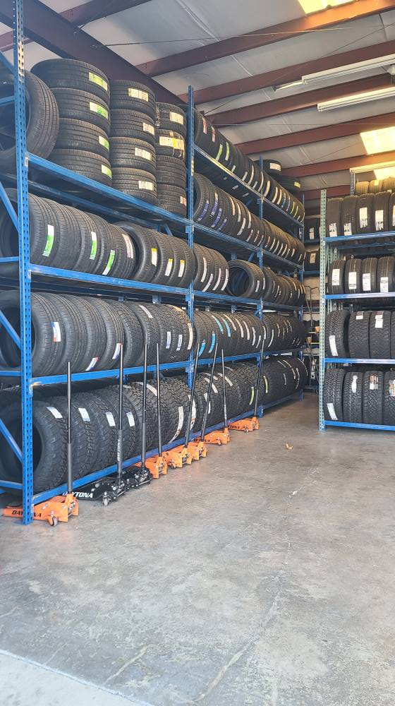 Warehouse aisle lined with in-stock tires