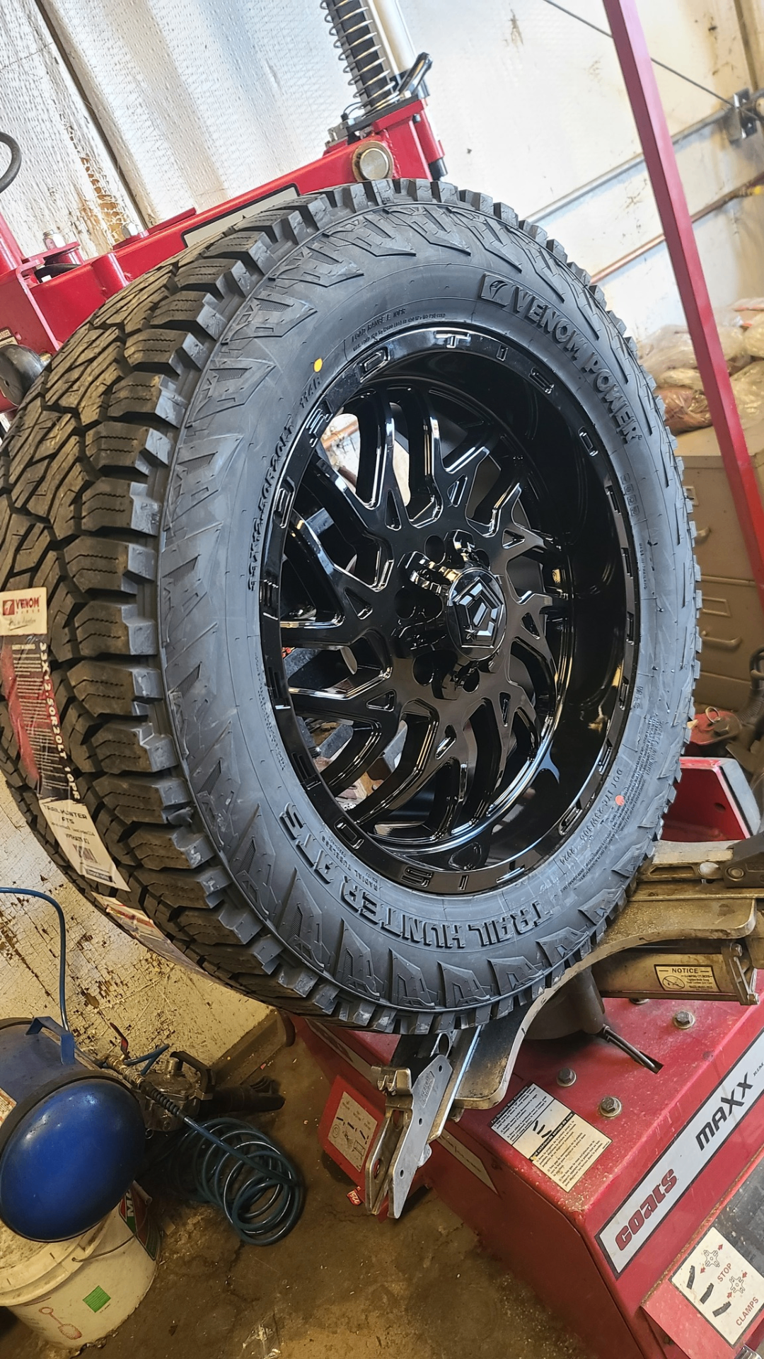 Venom Power tire on gloss black custom wheel